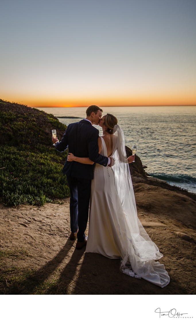 Bride and Groom Champagne Cheers at Sunset in La Jolla