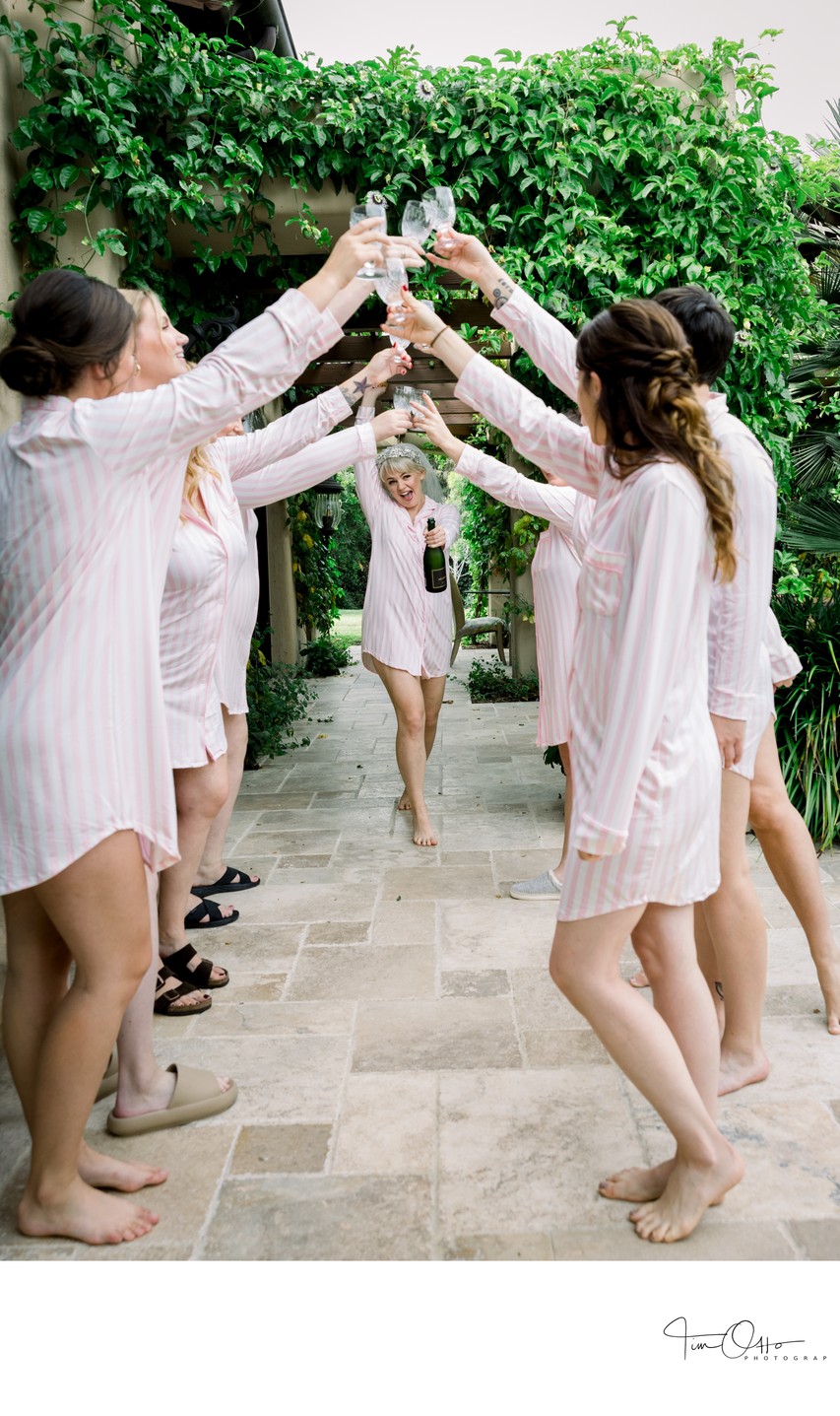 Champagne toast with bride and bridesmaids