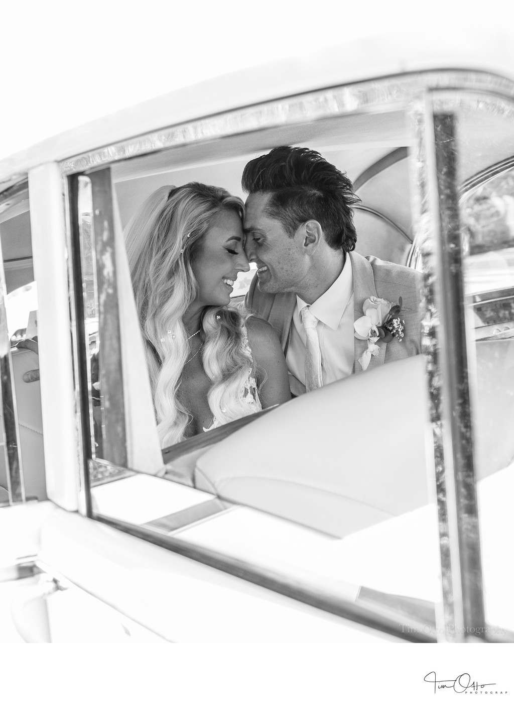 bride and groom in car