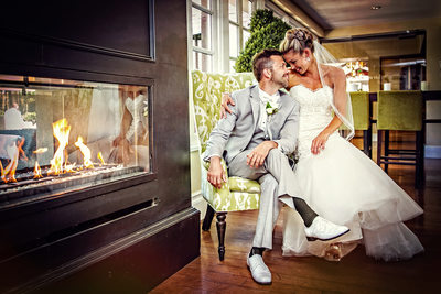 Bride and Groom enjoy fireplace at L'Auberge