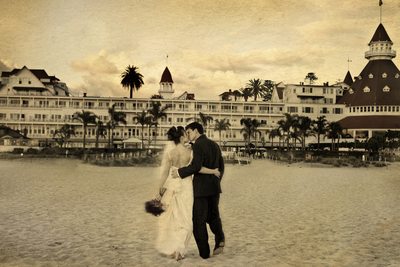 Kiss on the beach at Hotel Del Coronado wedding