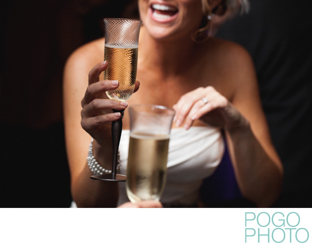 Happy bride toasts with her groom in Palm Beach Gardens