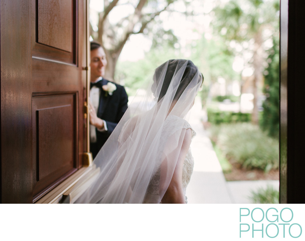 Bride exiting church into Orlando courtyard