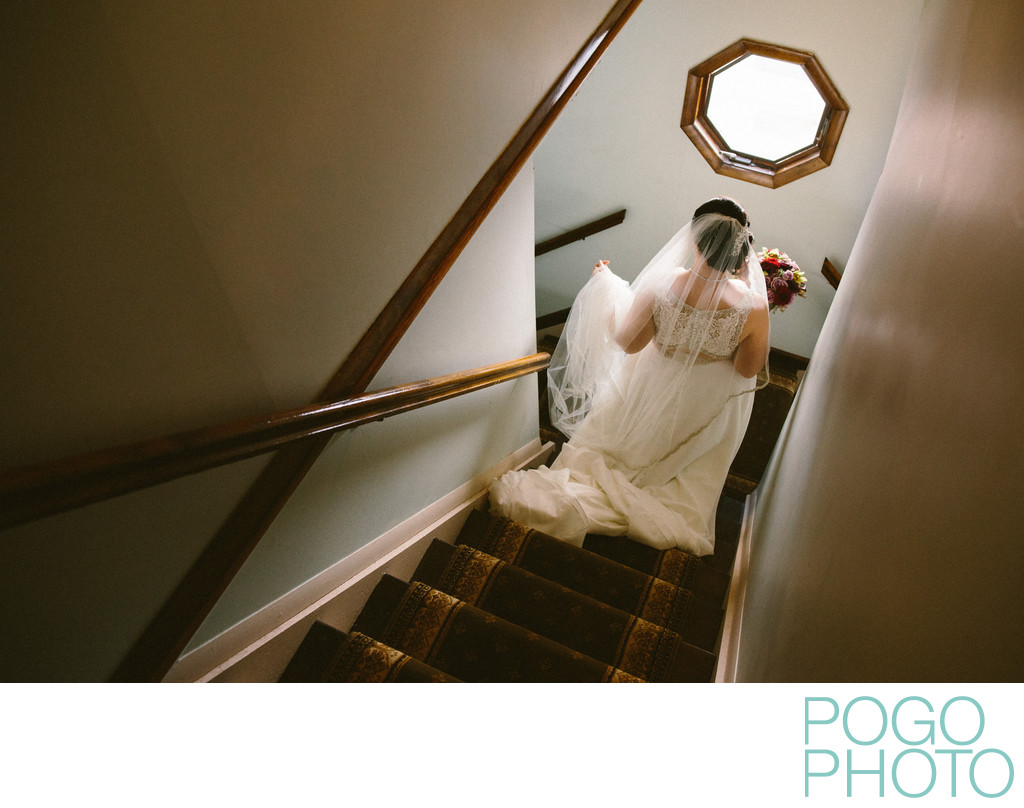 Photograph of Bride Descending a Staircase at Home