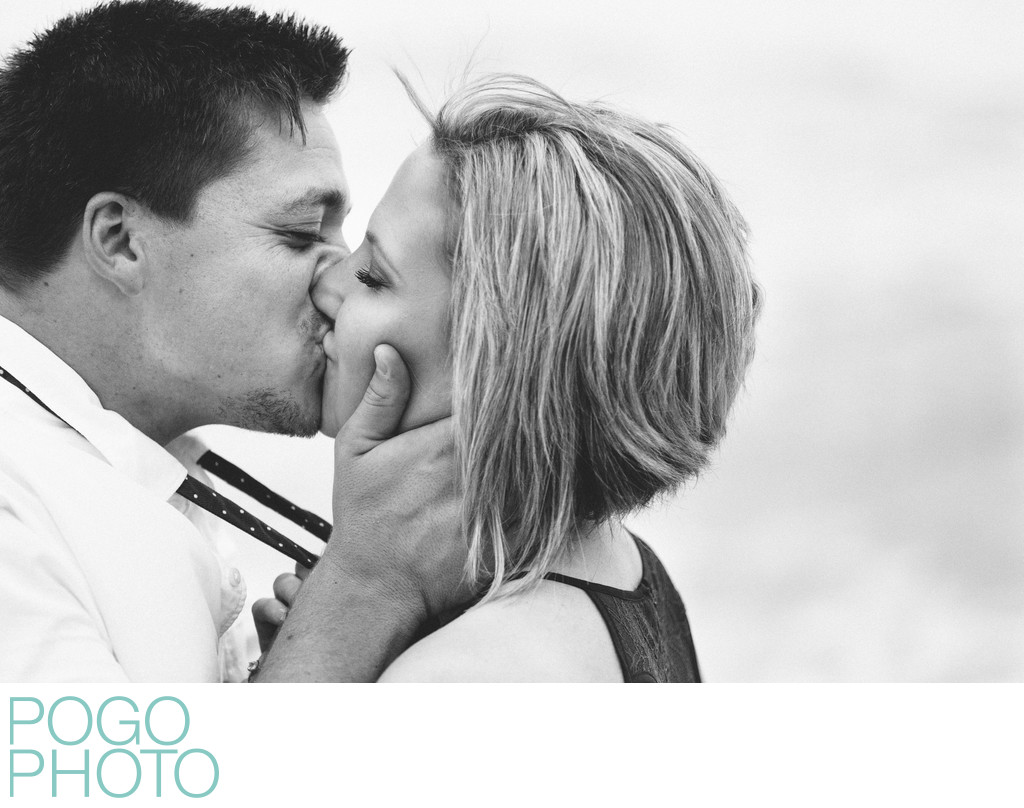 Black and White Photo of Passionate Kiss on the Beach