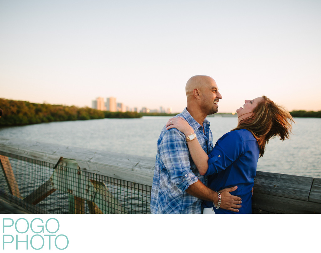 Engagement Photo on Boardwalk over Water at Sunset