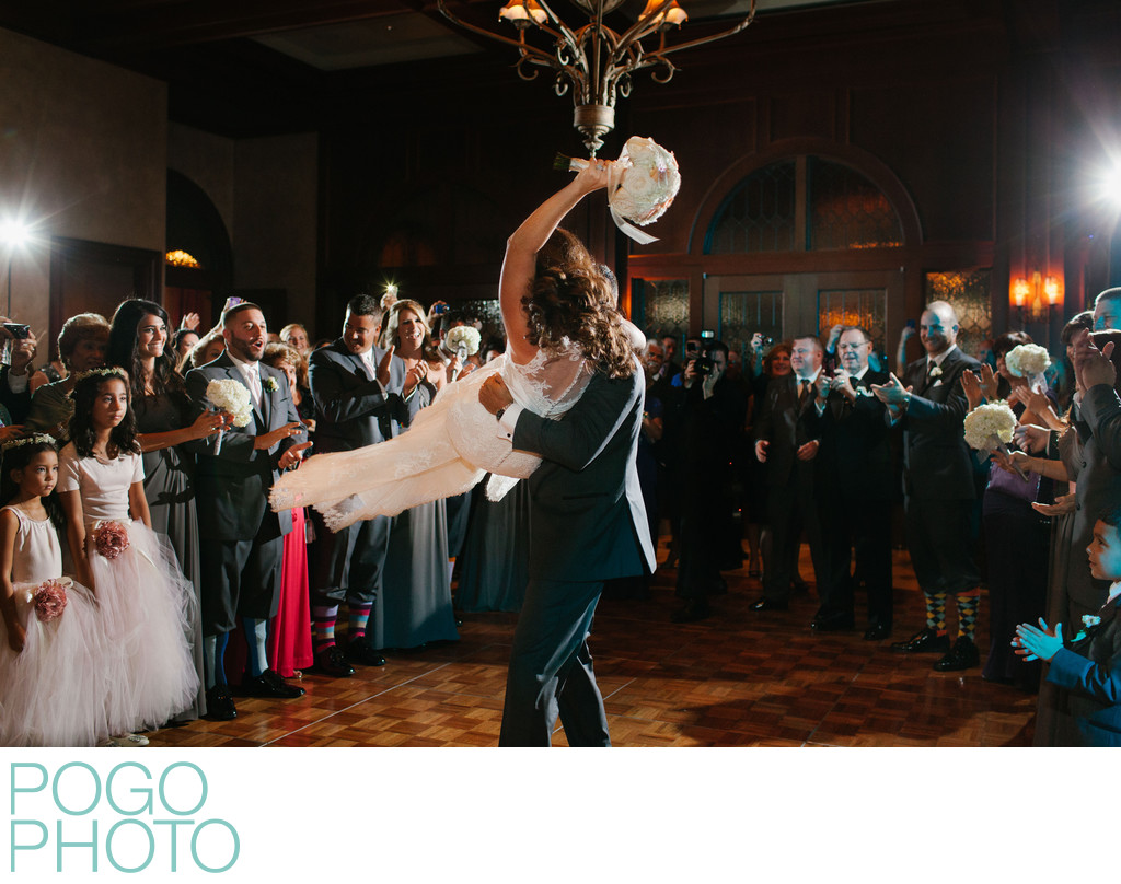 Groom Swinging Bride onto Dance Floor at Ritz Carlton