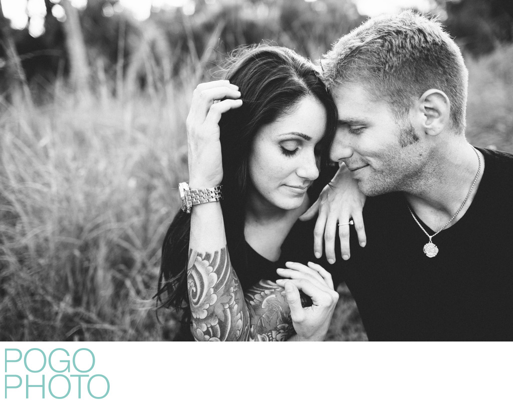 Tattooed Groom-to-be Snuggling with Fiancée in VT Field