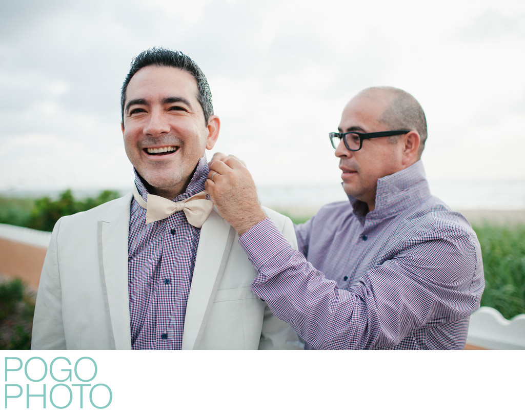 Two Grooms Help Each Other Prepare Before Gay Elopement