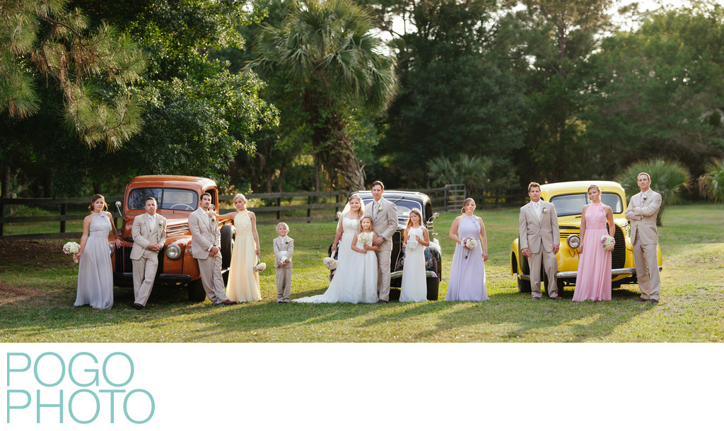 Wedding Party Panoramic Portrait with Antique Trucks