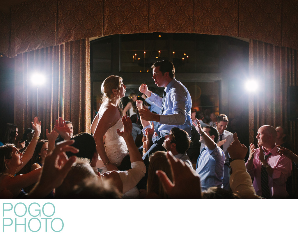 Wedding Couple on Guests Shoulders at Rocking Reception