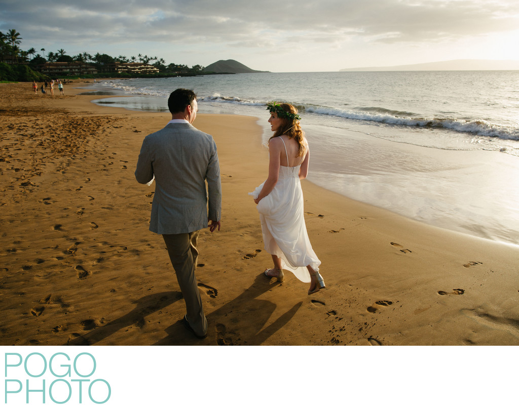 Post-ceremony stroll down the beach in Maui
