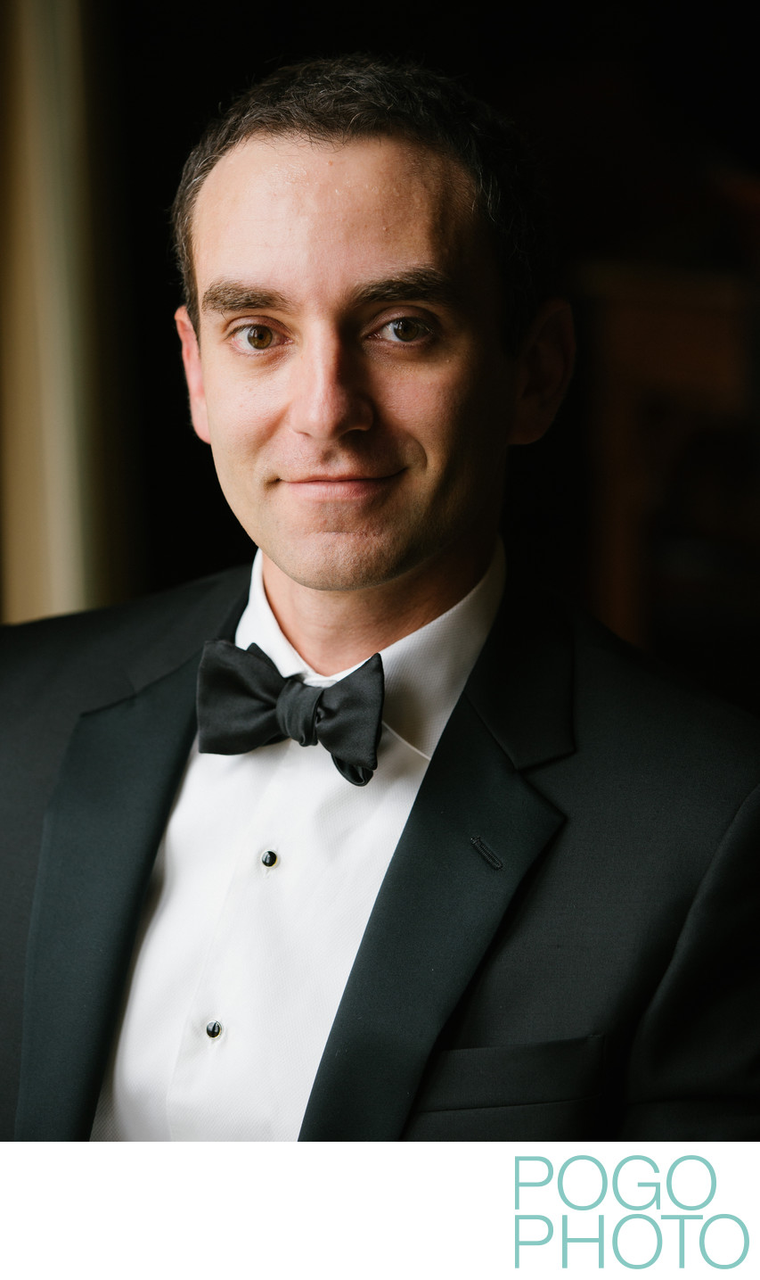 Handsome groom wearing a tux on his wedding day
