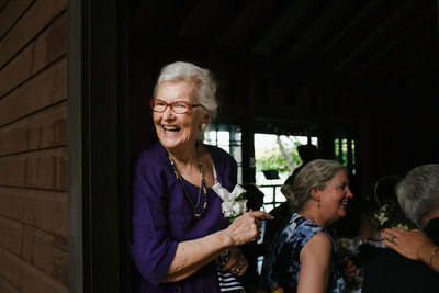 Laughing Grandmother at Camp Lodge Reception