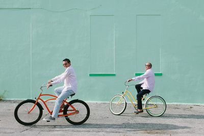 Playful South Florida Gay Engagement Photo with Bikes 