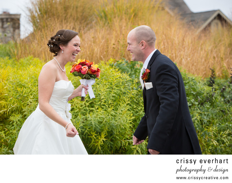 A bride and groom greet each other during first look