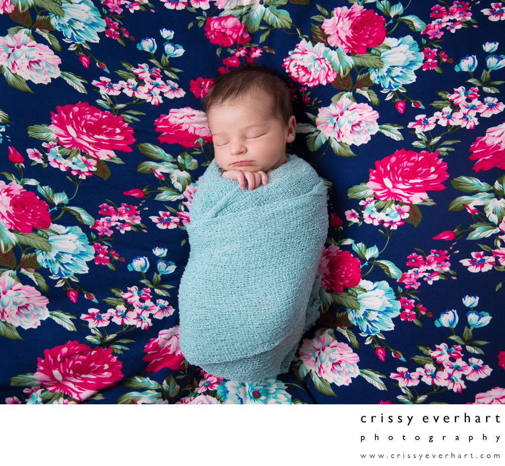 Newborn Girl on Floral Blanket, Pink and Teal