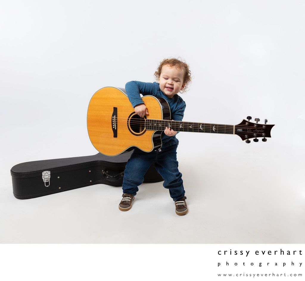 Studio Portraits of Active Toddlers - Boy with Guitar