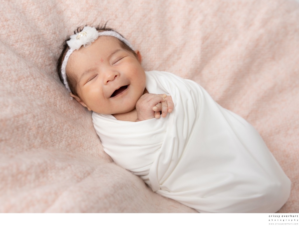Smiling Newborn Girl Photos