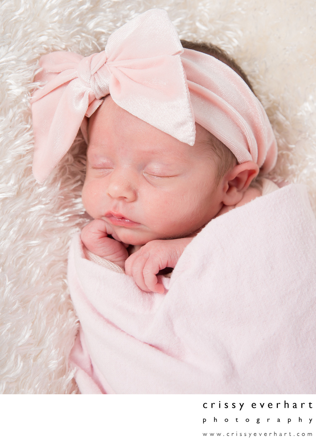 Sleeping Baby Girl in Pink Swaddle with Big Bow 