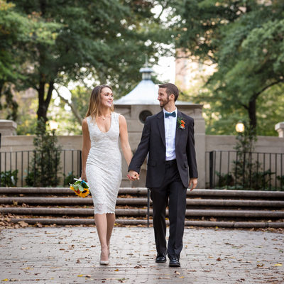Newlyweds walk down the path at Rittenhouse Square 