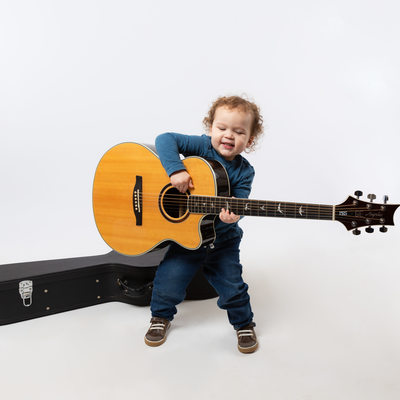 Studio Portraits of Active Toddlers - Boy with Guitar