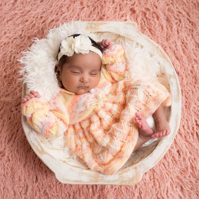 Infant Girl Asleep in Wooden Bowl, Pink