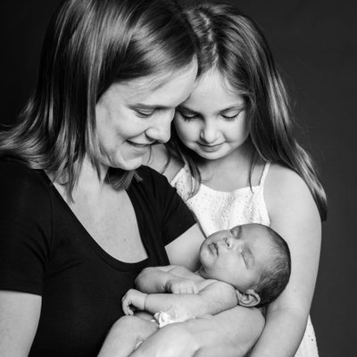 Mom and Daughters at Newborn Session