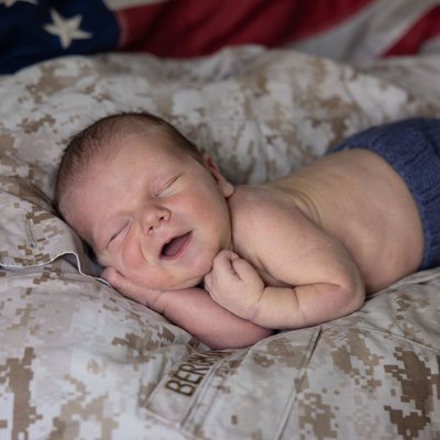 Baby on Daddy's Marine Corps Uniform