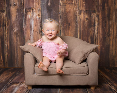 One Year Old Baby on Sofa - Portrait Studio