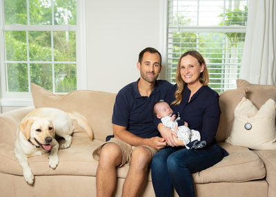 Newborn Photos with Parents and Dog on Sofa