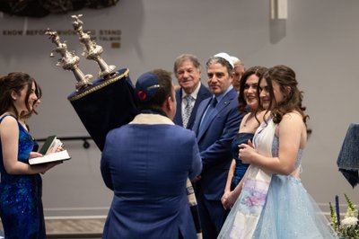 Rabbi Passing the Torah at Bat Mitzvah Service