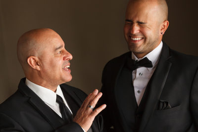 groom and his dad laughing
