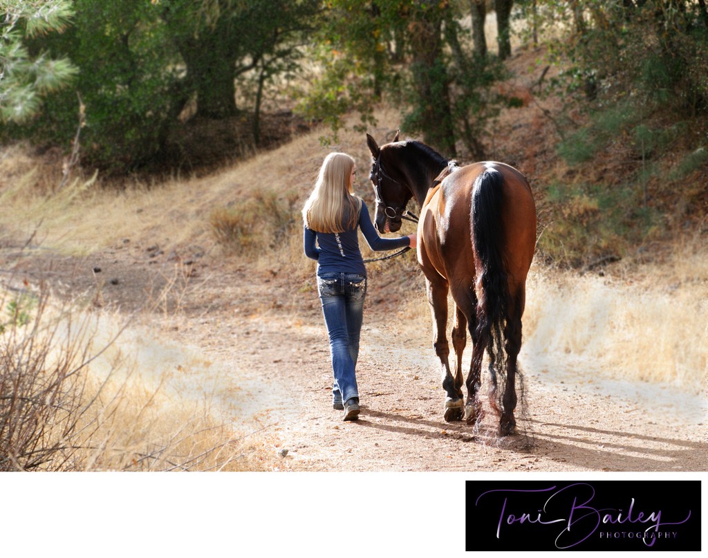 girl walking horse