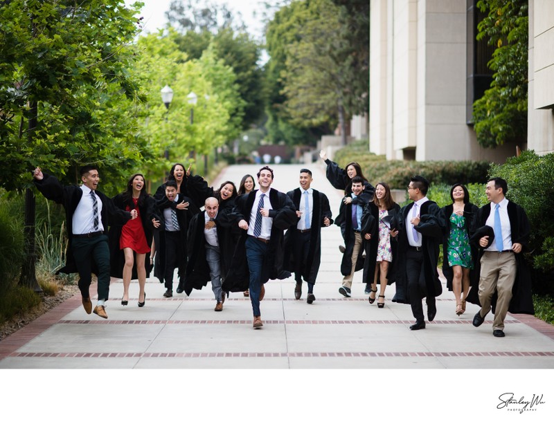 A young male happy graduate poses for his graduation photo Stock Photo -  Alamy