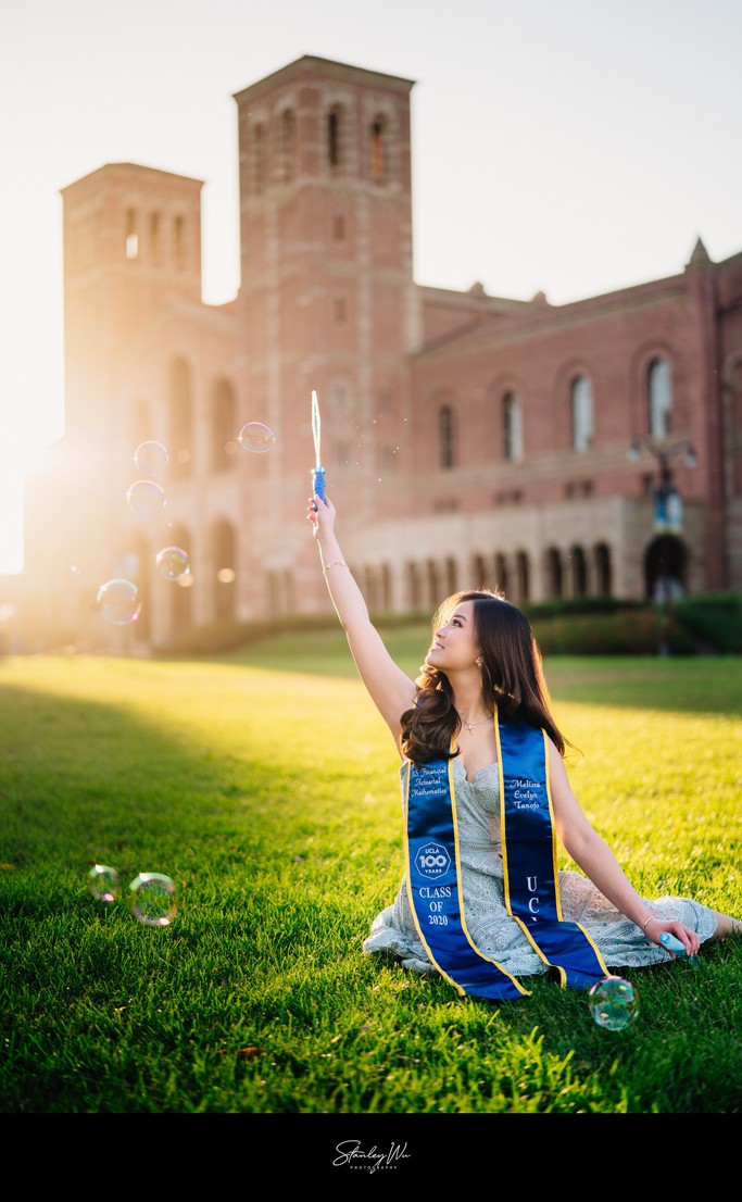 UCLA grad photo, bubbles, golden hour at Royce Hall