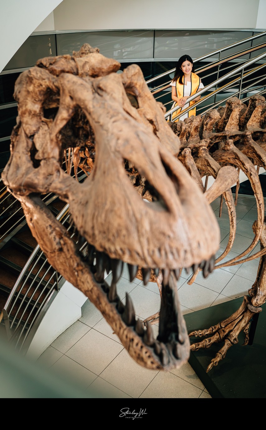 UC Berkeley Grad Beside Towering T-Rex Skeleton