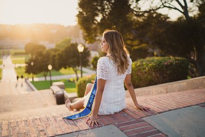 Grad Portrait Sitting by the Sunset at Janss Steps