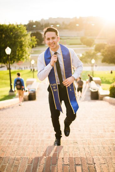 Portrait of a confident graduate walking up Janss Steps