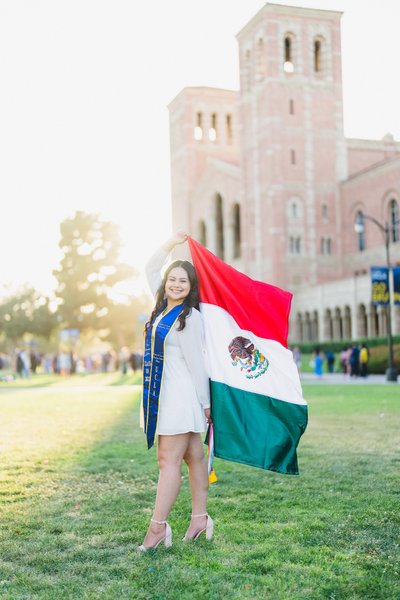 Bright Airy UCLA Graduation Portrait with Mexican Flag
