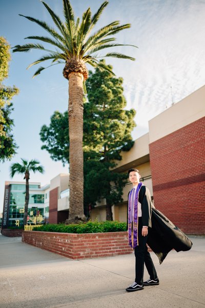 Cal Lutheran grad photo, palm trees, Swenson Science Center