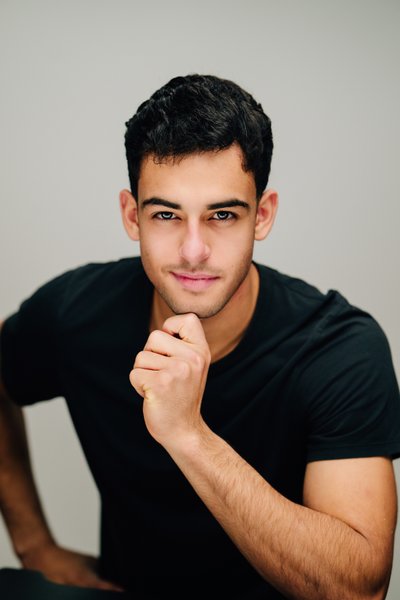 Tech founder headshot, casual studio, confident pose