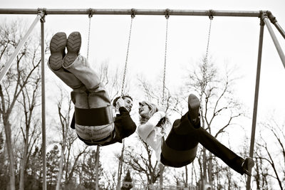 Park swings couple Denver engagement photography
