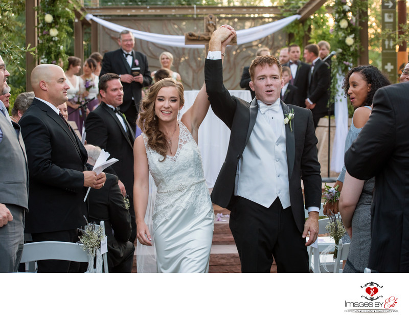 Wedding couple exiting from their ceremony at Springs Preserve