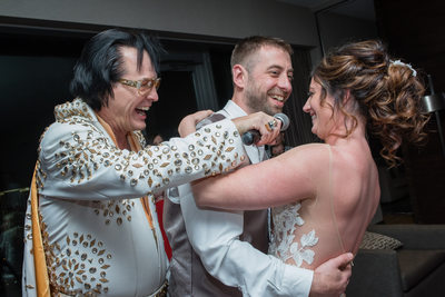 Elvis impersonator with bride and groom at Palms place penthouse suite