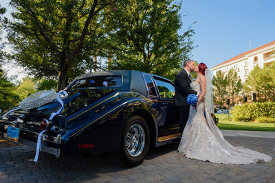 JW Marriott Las Vegas wedding Photo of the couple in front of an old car