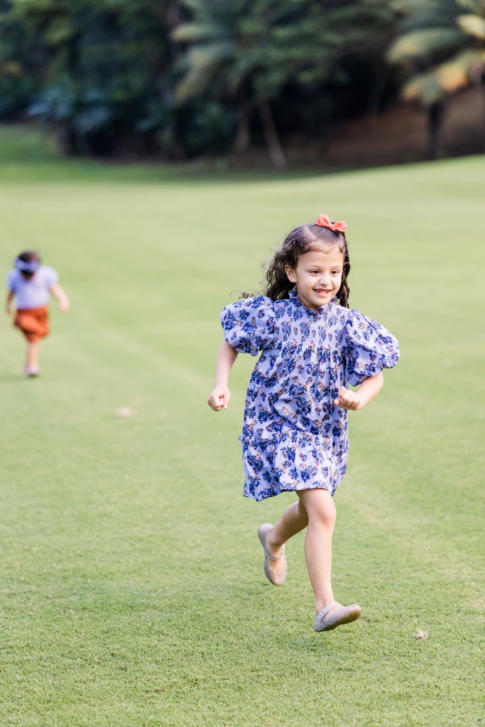 Girl running Tryall Club fairway Jamaica