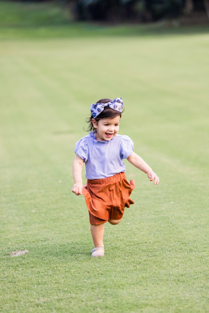 Toddler running Tryall Club fairway Jamaica