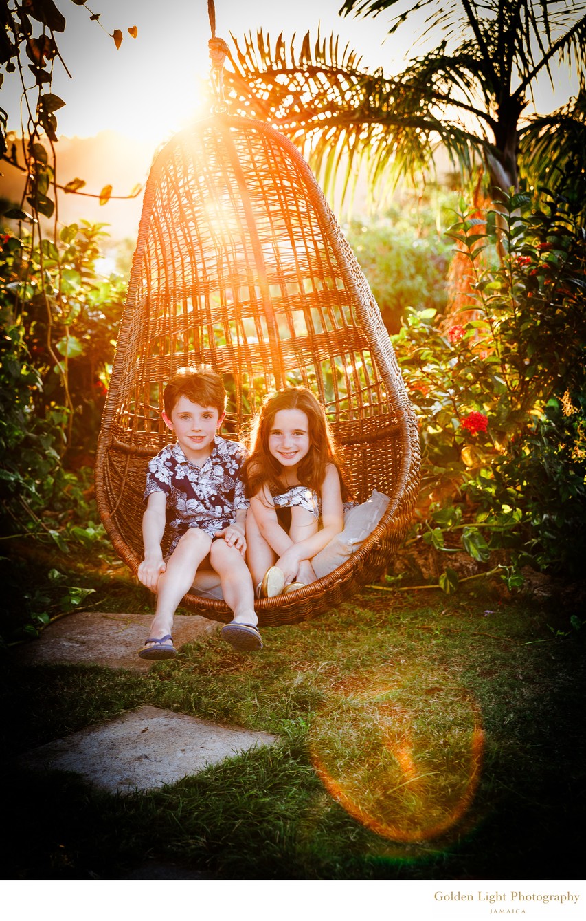 Children in hanging chair - Pimento Hill House, Jamaica