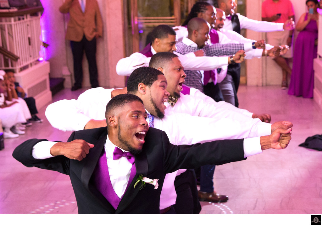 Dynamic Wedding Dance: Fraternity Brothers' Energetic Moves
